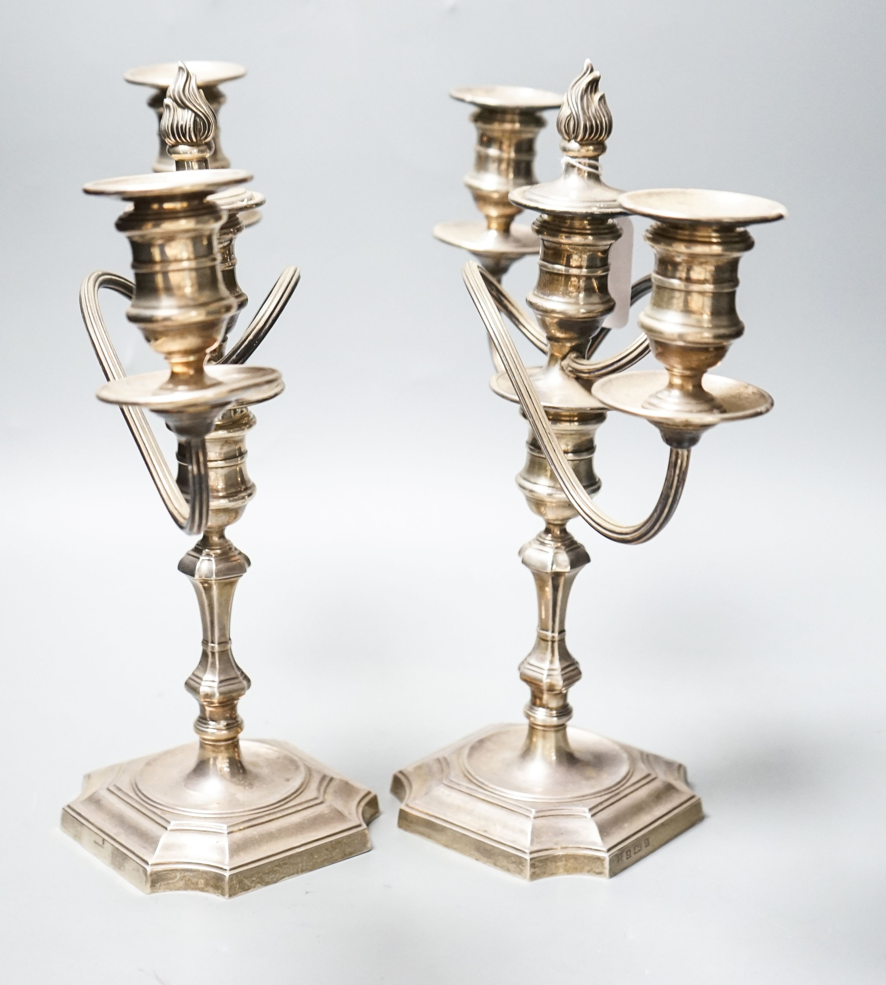 A pair of modern 1970's silver two branch, three light candelabra, height 30.4cm, weighted.